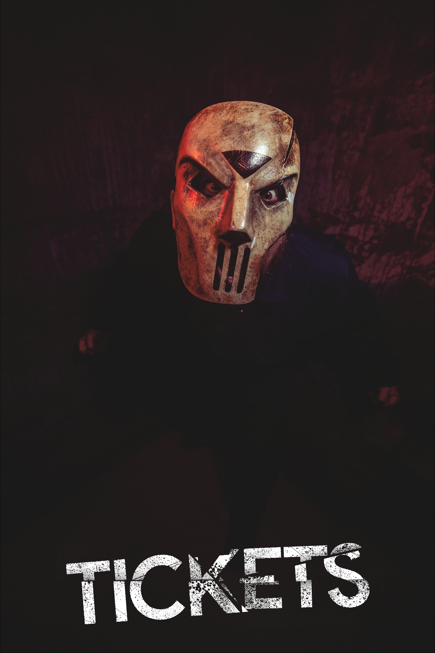 Tickets for SCREAMS! at Thornton Hall Country Park Masked scare actor wearing a cracked horror mask inside a dark haunted attraction at SCREAMS! at Thornton Hall Country Park with “Tickets” text overlay.